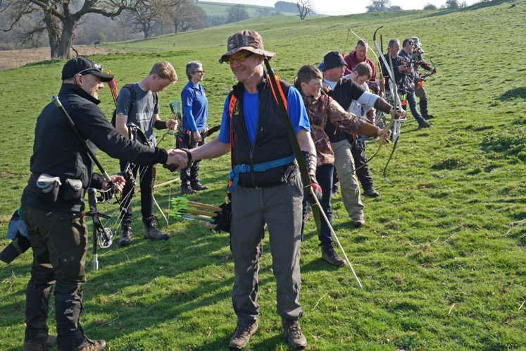 [archers practicing and greeting]